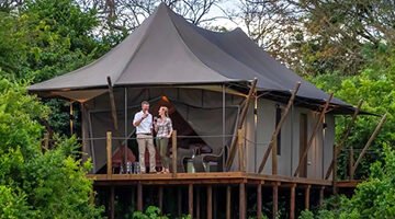 Family and couple enjoying tailored safari experiences in Uganda, with scenic views and diverse wildlife.