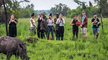 Photographing Rhino on a Uganda-Rwanda Safari Tours in Zziwa Sanctuary.